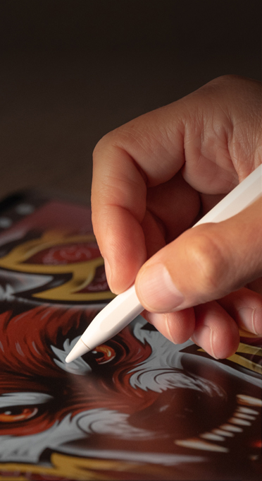 Apple Pencil: A hand hoilding an Apple Pencil, and illustrating on iPad.