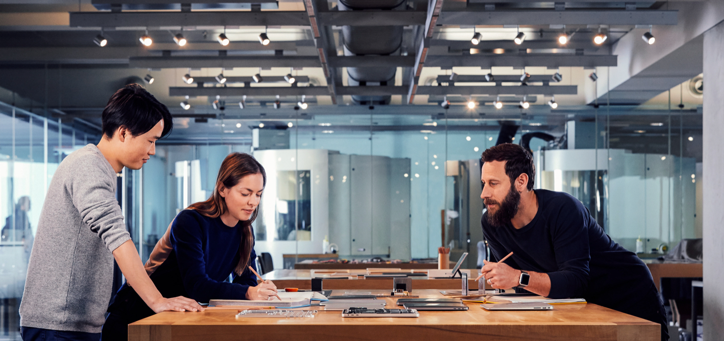 Apple designers collaborate on a project in their studio