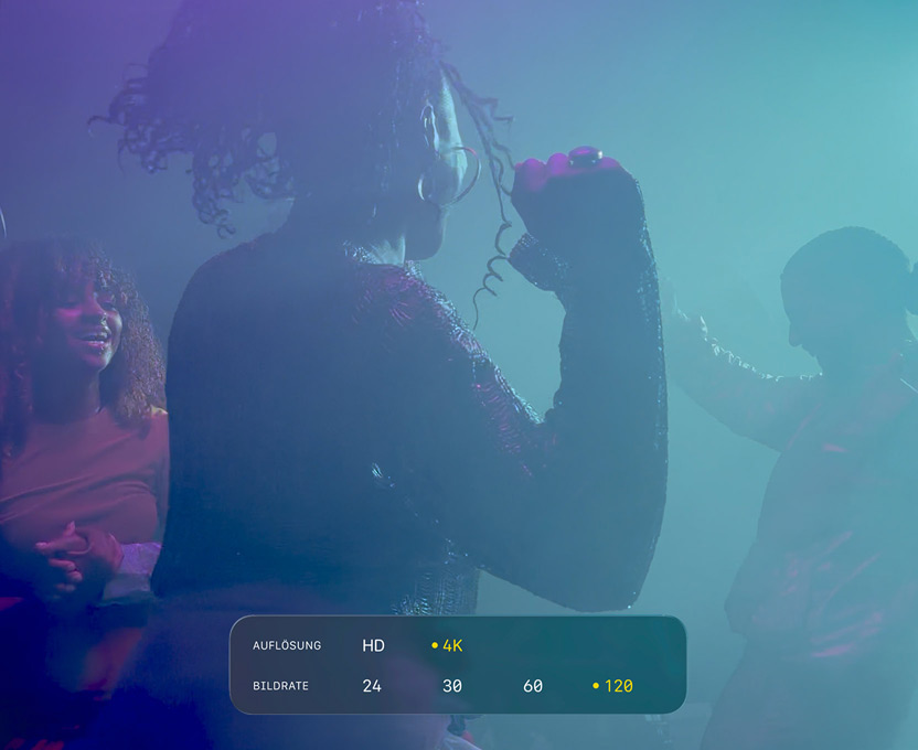 Ein Display mit tanzenden Personen, die bei wenig Licht gefilmt werden, zeigt das Potenzial von 4K 120 fps Dolby Vision