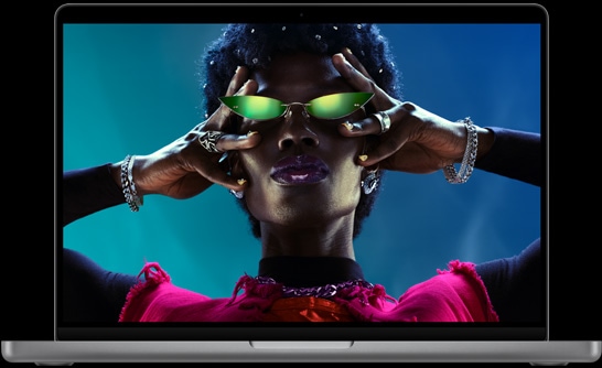 Colorful screen on a MacBook Pro of a person wearing sunglasses, showcasing the vibrant Liquid Retina XDR display