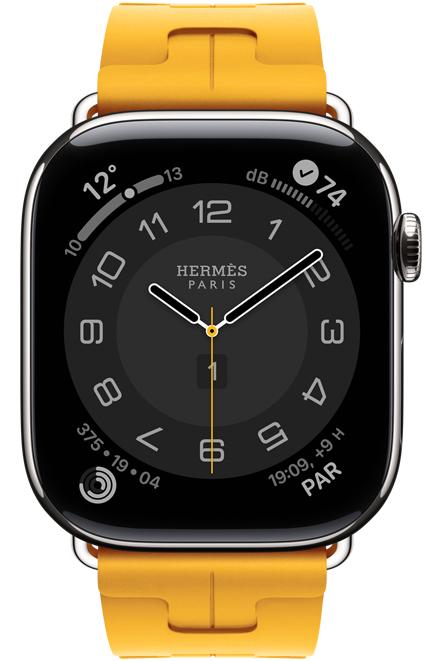 Apple Watch Hermès Series 11, carátula Circulaire analógica (agujas de hora, minuto y segundo, complicaciones: Clima, círculos de Actividad, hora de París y Ruido), caja de titanio, color plata, parte lateral derecha, Digital Crown, con la correa Kilim Simple Tour, color Jaune (amarillo canario), fluoroelastómero