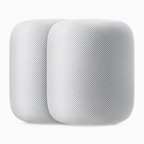 Dos altavoces HomePod blancos.