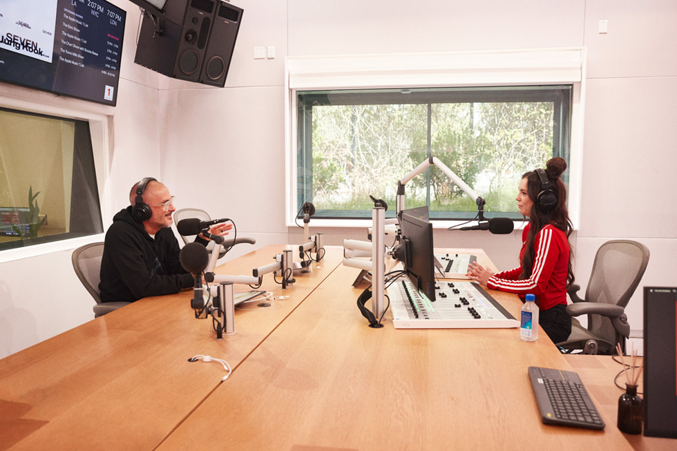 Zane Lowe and Amy Shark in a recording studio.