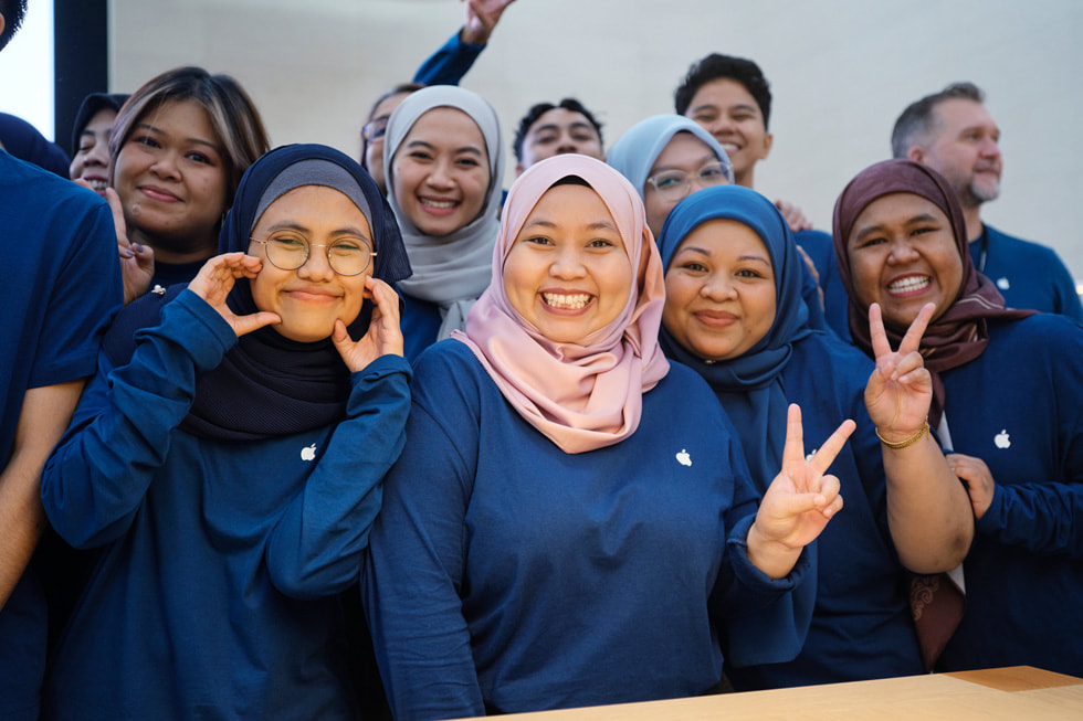 Team members at Apple The Exchange TRX pose for a group photo.