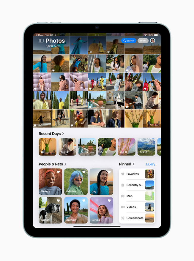 The redesigned Photos app is shown on iPad mini.