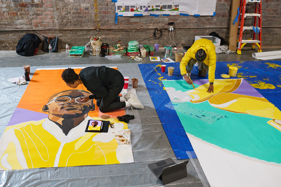 Youth artists working on their pieces of the Arts New Orleans mural.
