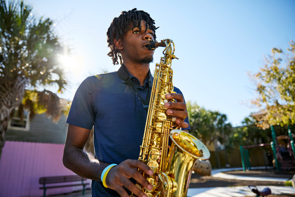 Ellis Marsalis Center for Music participant Jacob Jones Jr. plays the saxophone outside the center.