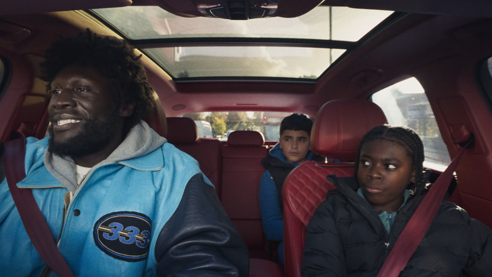 Stormzy with young co-stars in a car.