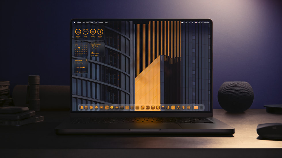 MacBook Pro shows the Home Screen with the new design. 