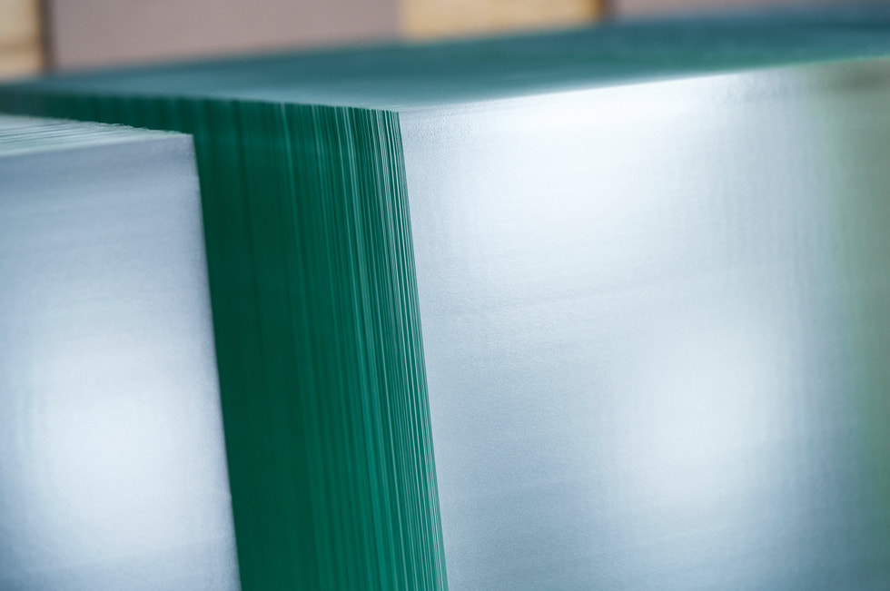A close-up of a slab of glass inside a Corning facility.