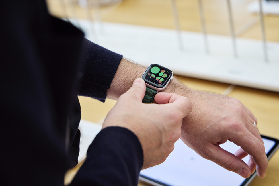 A customer tries on the new Apple Watch Series 11. 