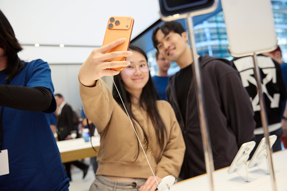 Two happy customers take a selfie using iPhone 17 Pro at Apple Sydney in Australia.