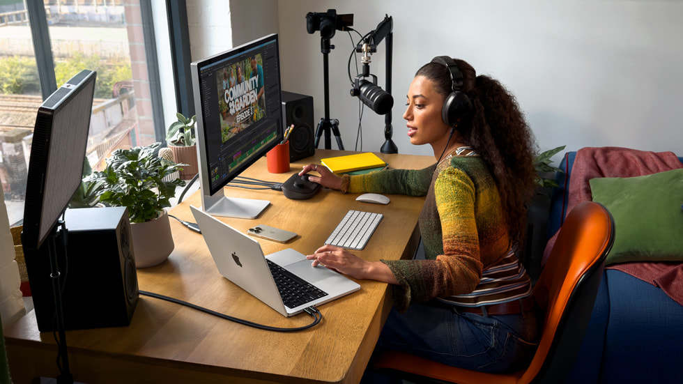 A lifestyle photo shows a person working with the new 14-inch MacBook Pro, an external display, and recording equipment. 