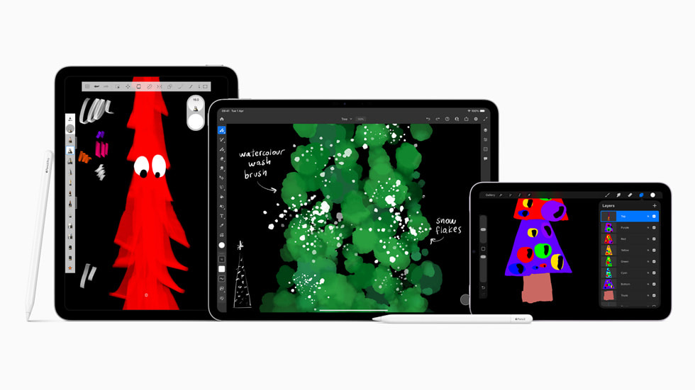 An image of Christmas tree drawings on three separate iPads with Apple Pencils.