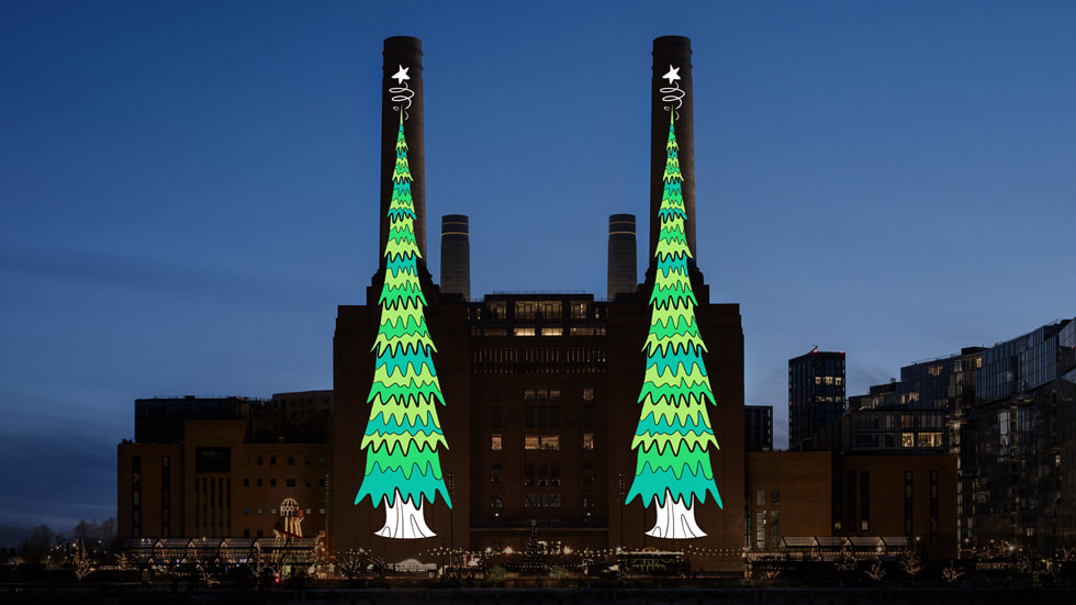 An image of Christmas tree artwork on the Battersea Power Station chimneys.