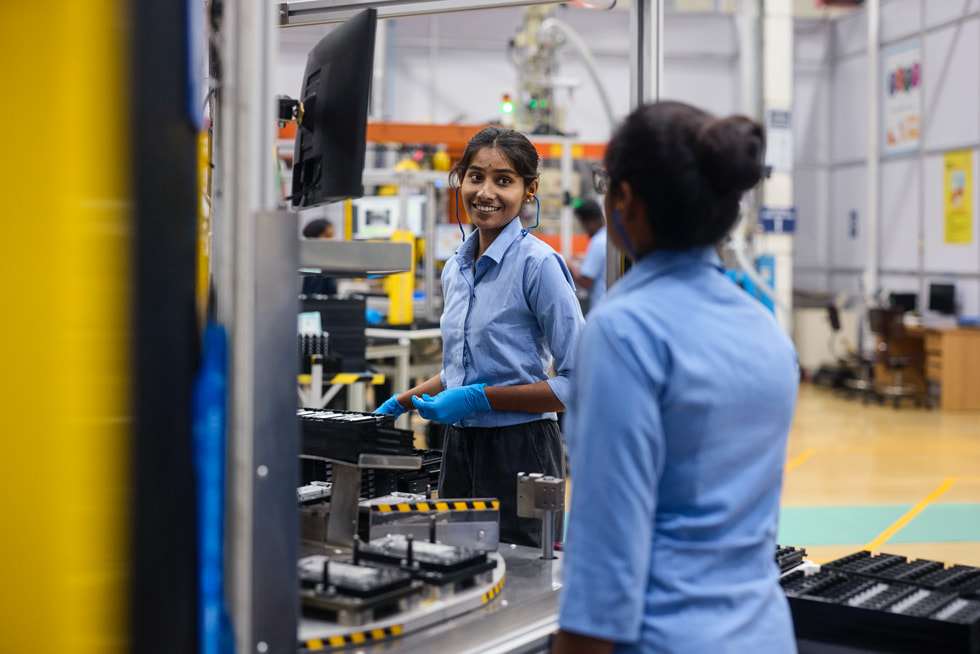 Employees collaborate at a supplier facility in India.