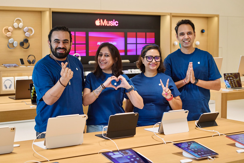 Four team members pose at Apple Borivali.