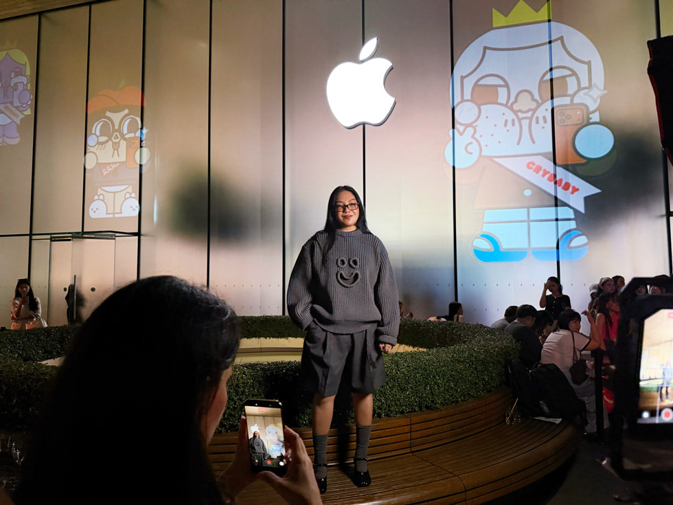 Artist Molly Yllom poses for a photo shot on iPhone at Apple Iconsiam in Bangkok.