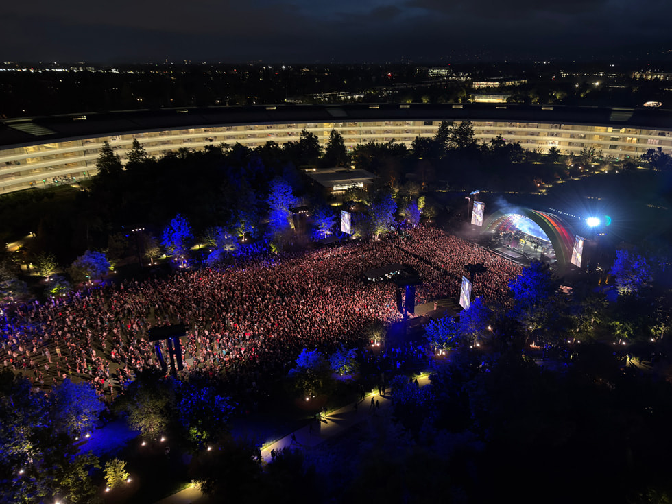 A view from above shows the crowd and stage as Paul McCartney performs at Apple Park in Cupertino.