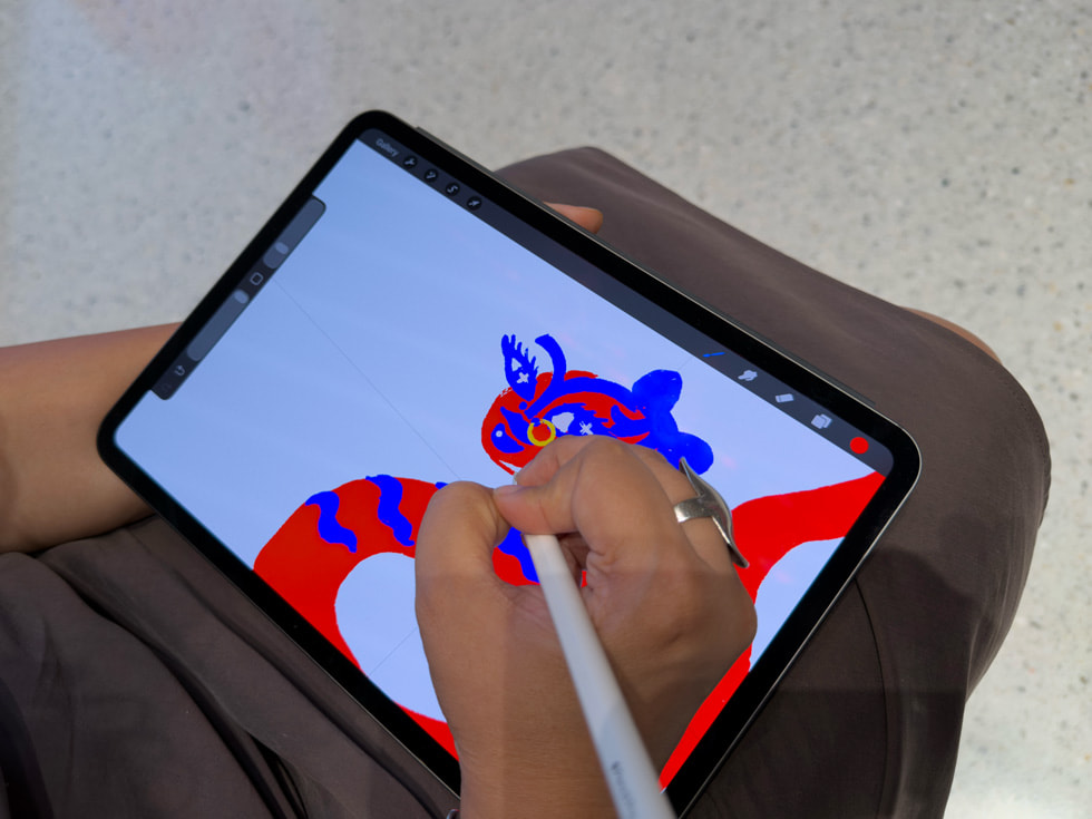 A close-up of Malhotra drawing with Apple Pencil Pro on iPad Pro in the Procreate app.