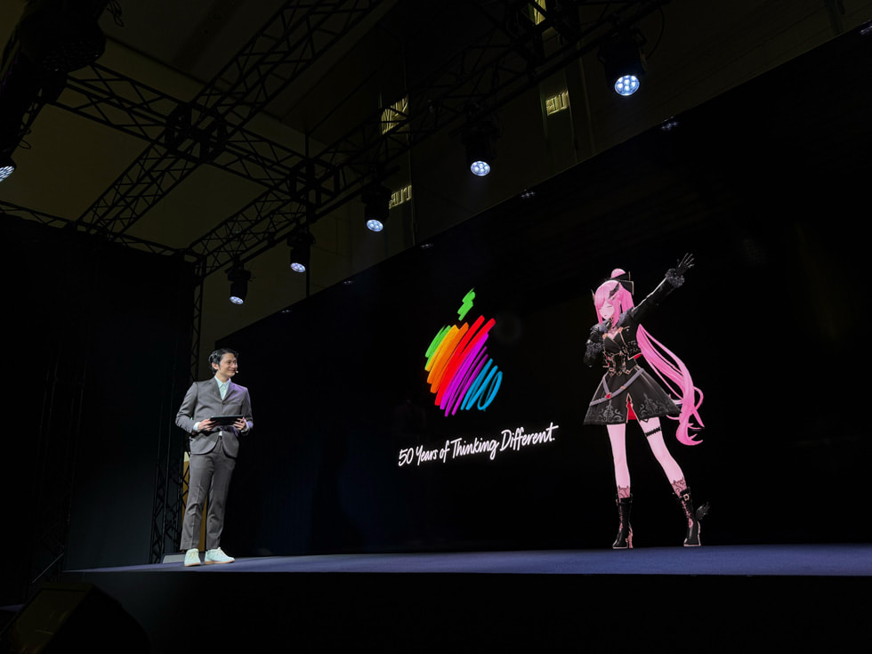 Mori Calliope is pictured performing on the stage at Apple Omotesando in Tokyo.