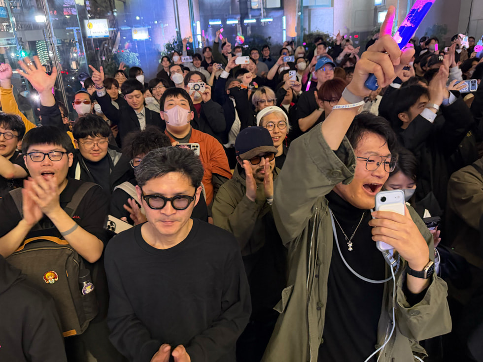 The crowd cheers as Mori Calliope performs on the stage at Apple Omotesando in Tokyo.