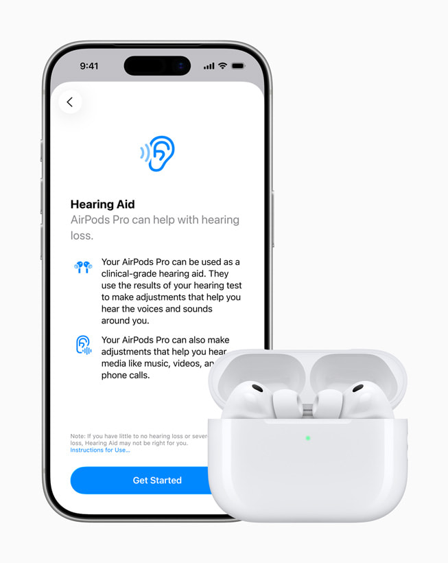 A user’s iPhone shows a screen for the Hearing Aid feature, and sits next to the user’s AirPods Pro.