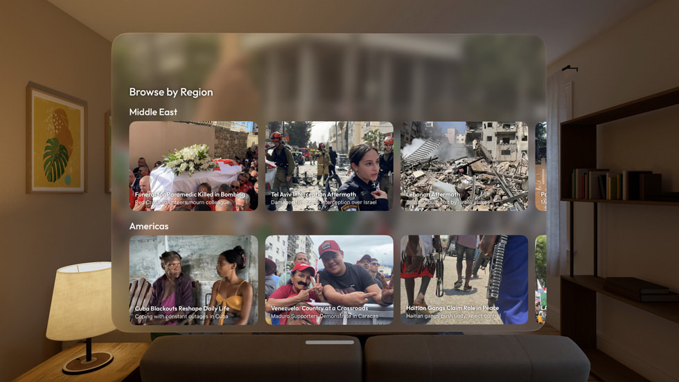 The Primary: News in Depth app on Apple Vision Pro shows a grid of news story images floating in a living room environment.