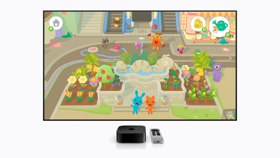 The Sago Mini Jinja’s Garden game displayed on a TV screen, with an Apple TV and Siri Remote in front, shows cartoon characters in a garden.