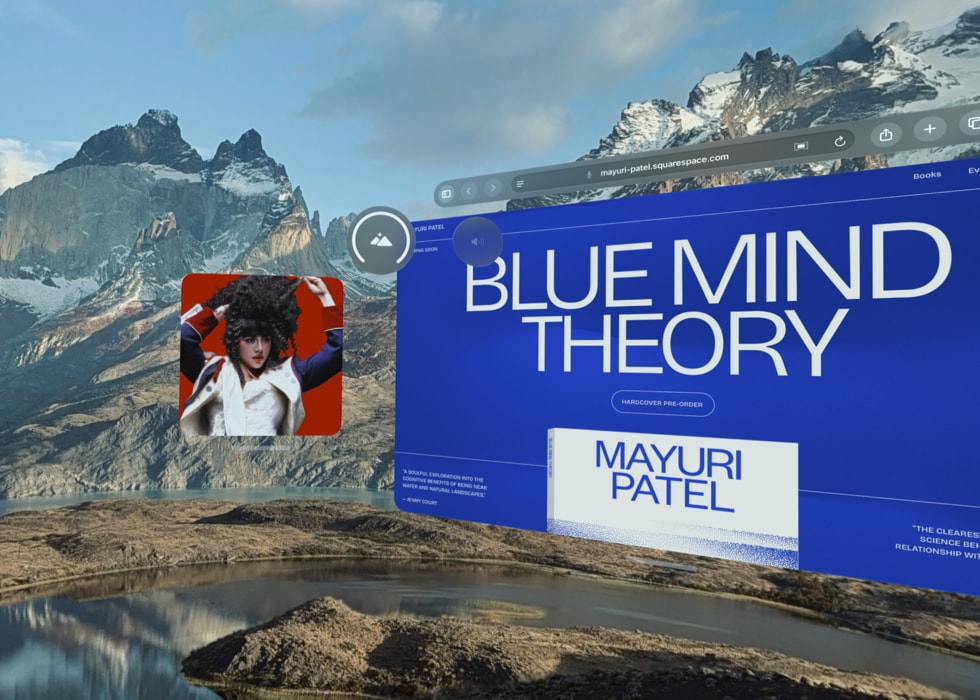 An Apple Vision Pro screen shows a mountain panorama.