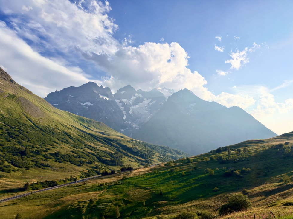 A photograph of a mountain landscape is captured on iPhone 18 Pro.