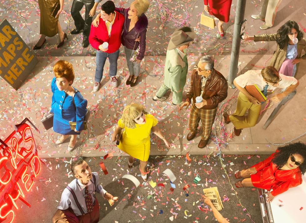 A photo shows people walking in a city scene with confetti on the ground, a neon sign, and a “Star Maps Here” sign on the sidewalk.