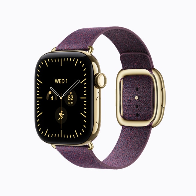 Apple Watch Series 12 in radiant gold titanium with a camel Modern Buckle band.