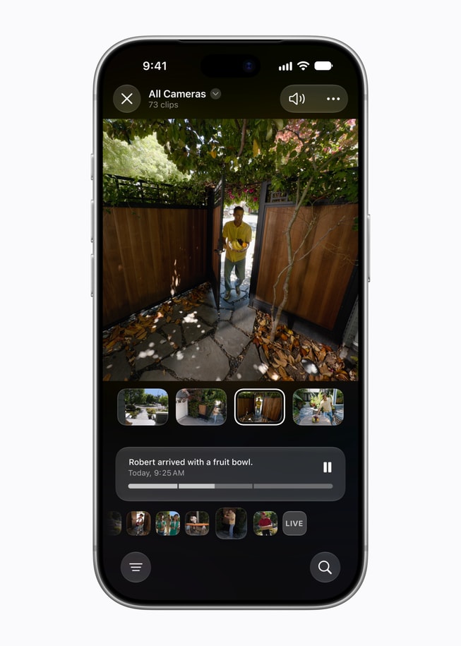 A user gets a notification about a person arriving at their home with a bowl of fruit.