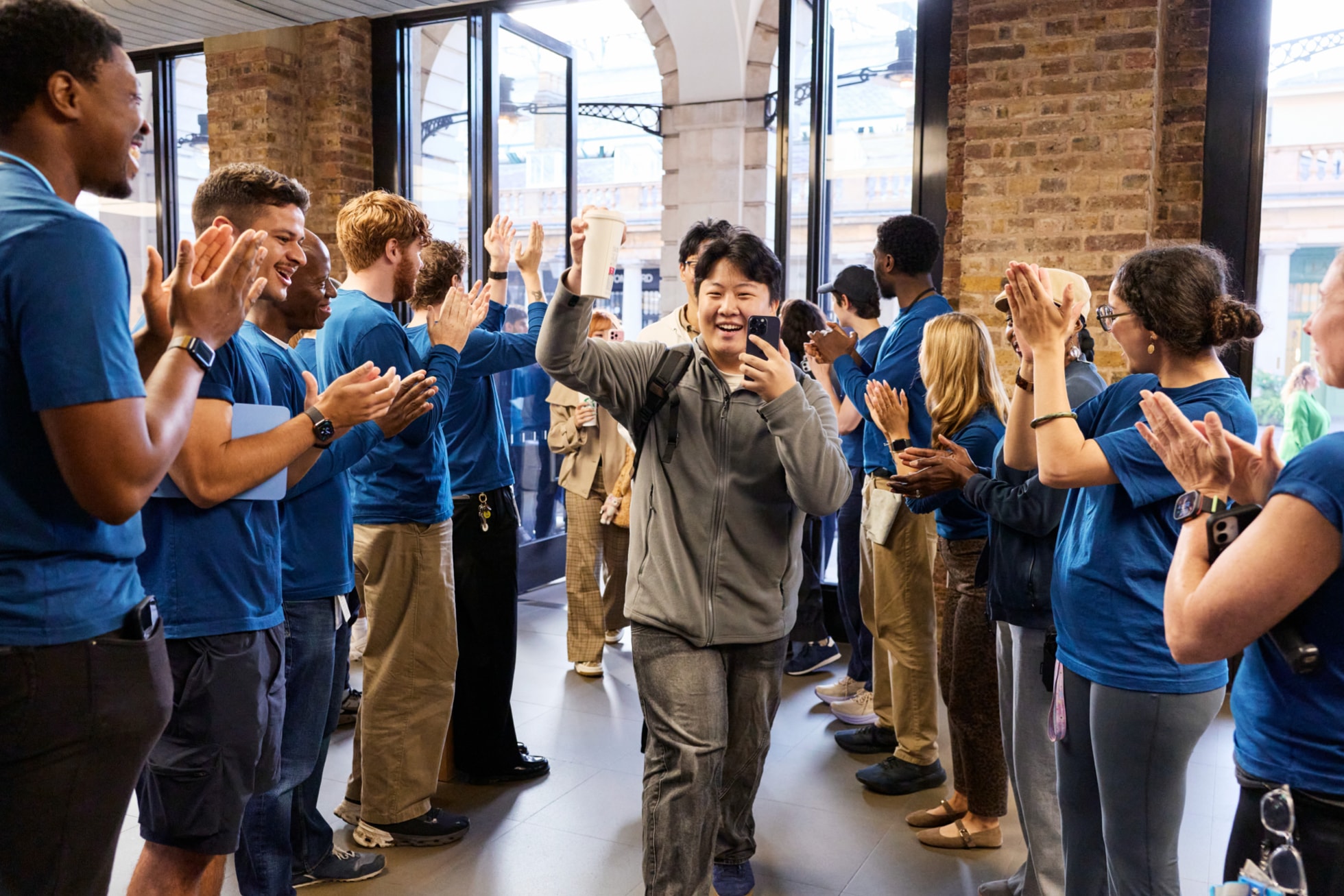 Apple team members greet incoming customers at Apple Covent Garden.