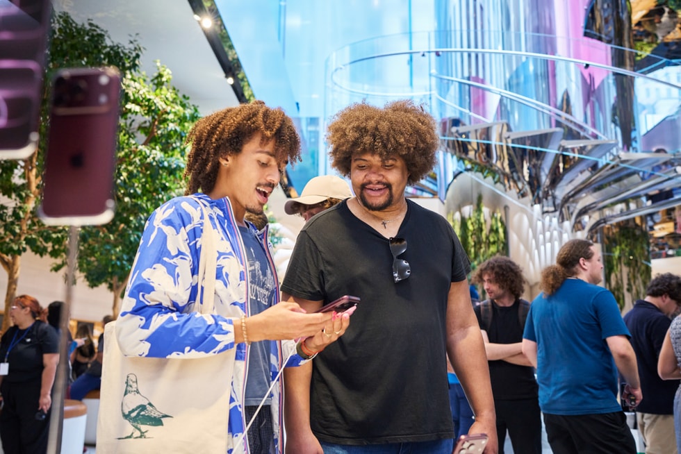 Two customers try out the new iPhone 18 Pro at Apple Fifth Avenue.