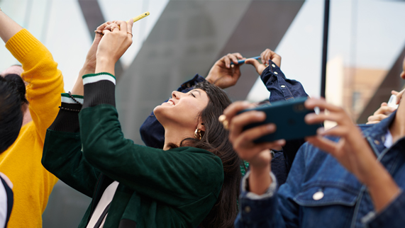 Customers capturing photos on iPhone XR.