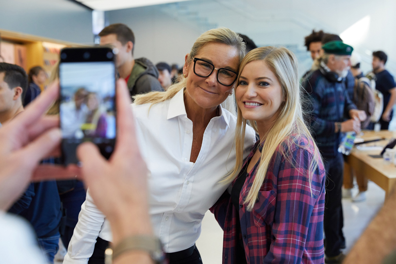 Angela Ahrendts poses for a photo with iJustine at Apple Union Square in San Francisco.