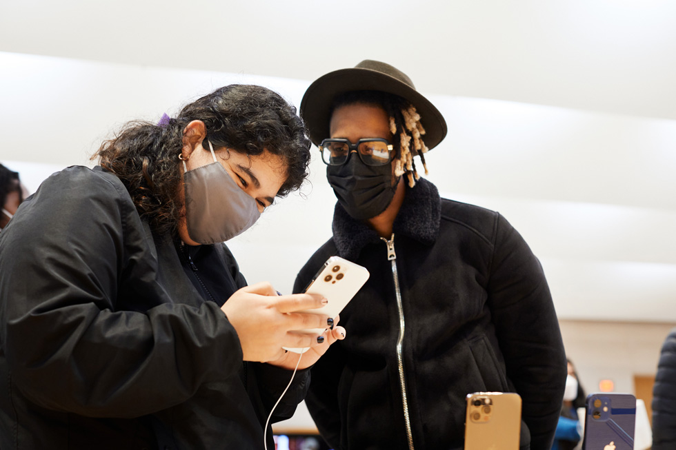 A customer tests out the new iPhone 12 Pro Max. 