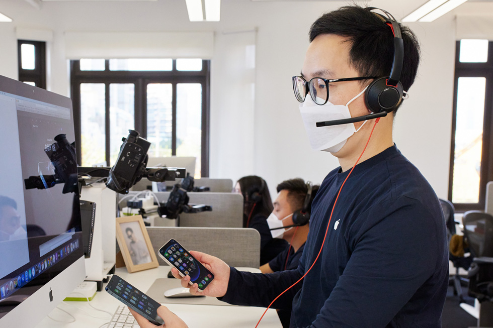 An Apple online team member at the call center in Shanghai advises a customer on the new iPhone 12 models. 