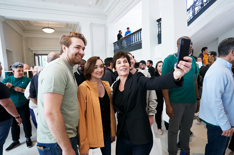 Deirdre O’Brien with team members at Apple Carnegie Library.