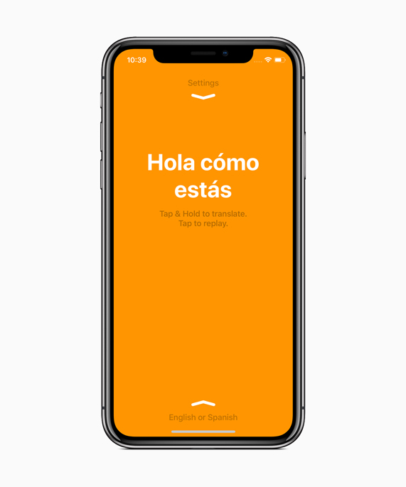 iPhone X showing an orange iTranslate screen translating a sentence in Spanish