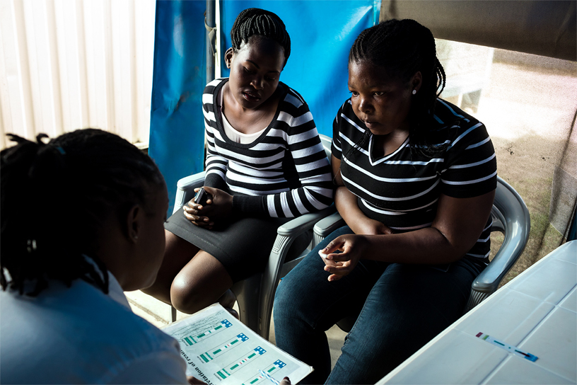 Dotty consults Helima and her friend Winny.