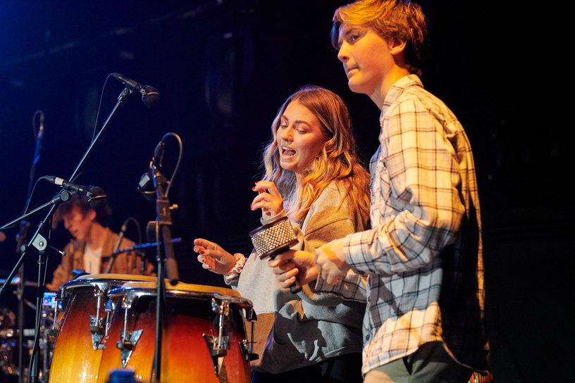Two students playing percussion.
