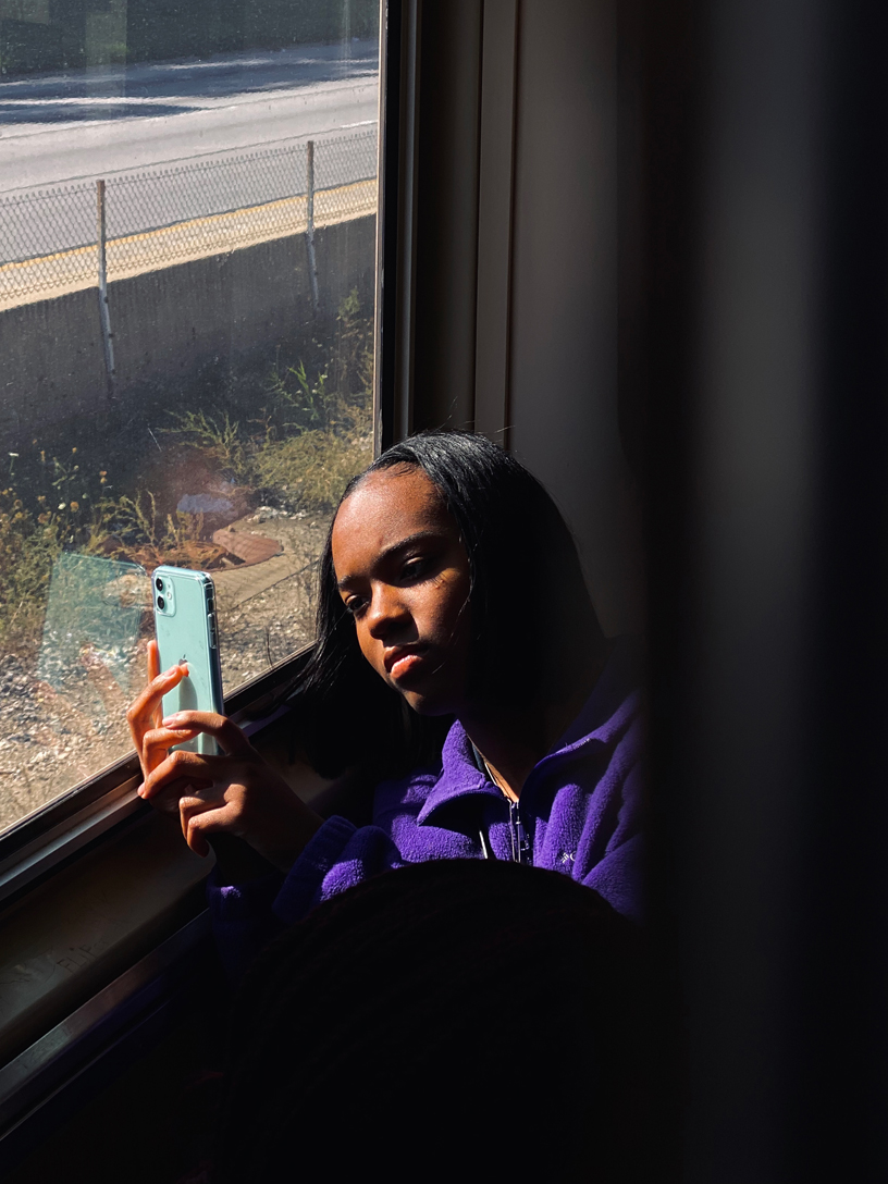 Janiya with iPhone 11.