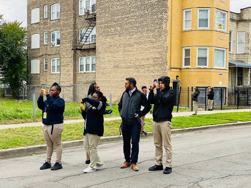 Amit Khatkhate and DRW College Prep students.