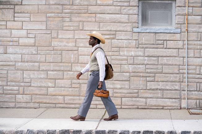 Conphidance walking down the street in “Little America.”