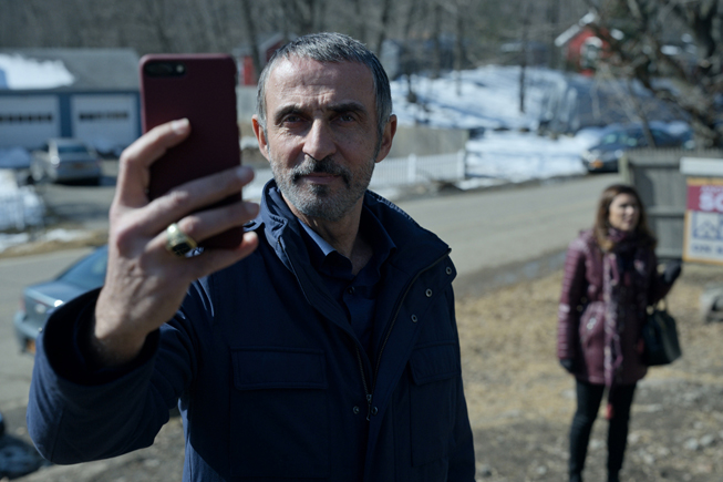 Shaun Toub taking a picture and in “Little America.”