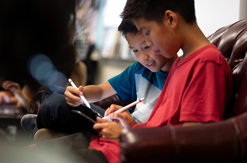 Two students using Apple Pencil.