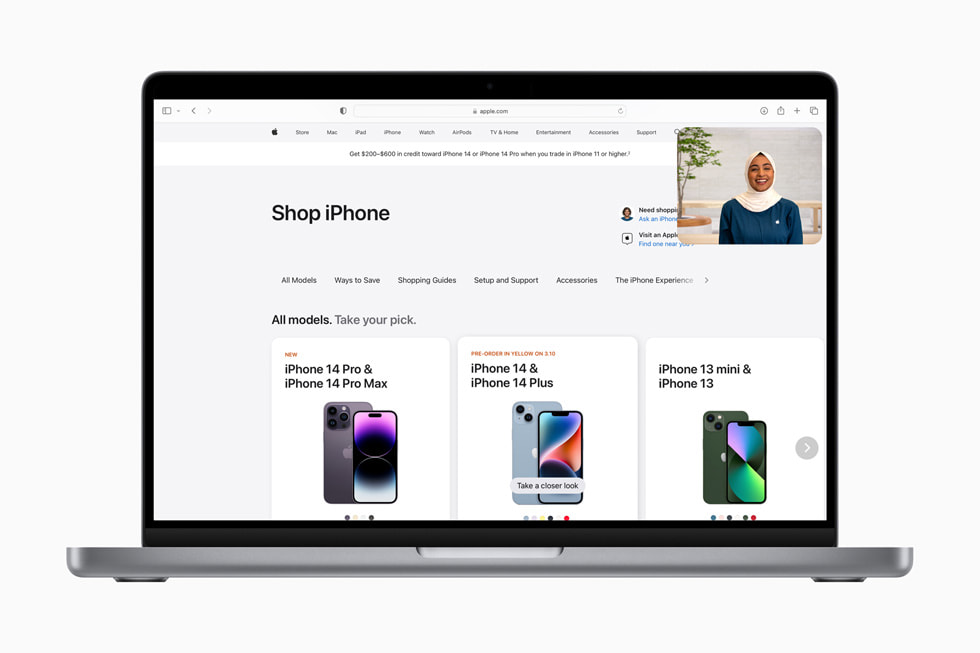 The Shop with a Specialist over Video experience is shown over an [apple.com] (https://new-cm-edgedigital-eca.pages.dev) page reading “Compare iPhone models” and showing iPhone 14 Pro Max, iPhone 14 Plus, and iPhone 14.